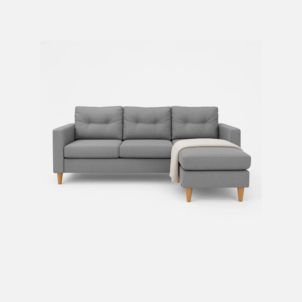 Sala en L Cielo con módulo tipo puff intercambiable tela color gris con patas de madera y frazada beige vista desde frente