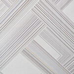 Detalle de tapete en tonos grises y plateados con textura de patrón geométrico. All Star decoración