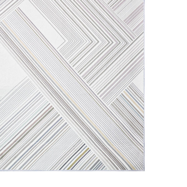 Detalle de tapete en tonos grises y plateados con textura de patrón geométrico. All Star decoración