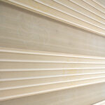 Detalle de persiana enrollable tipo zebra en tono beige con textura de tela de flores. All Star decoración