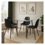 juego de comedor Corvus cuatro puestos rectangular con tapa de vidrio y patas metálicas negras, 4 sillas negras, ubicado en ambiente moderno minimalista. All Star Comedores