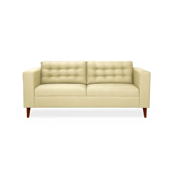 Sofá Honey 3 puestos tapizado en color beige con capitoneado, patas en madera maciza tono envejecido al 100% torneadas, visto desde frente. Muebles All Star