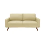 Sofá Río tapizado liso en color beige con patas en madera maciza envejecidas al 100% torneadas visto desde frente. Muebles All Star